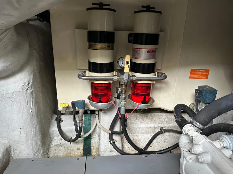 Slide: The Image of Engine room of 2008 Azimut 62 Evolution yacht showing fuel filters and hoses. - 37