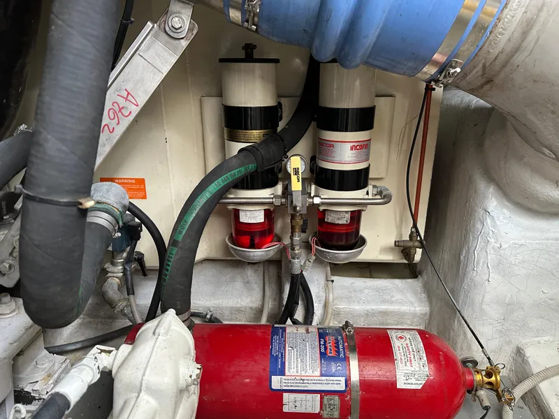 Slide: The Image of Engine room of 2008 Azimut 62 Evolution yacht with filters and fire extinguisher. - 38