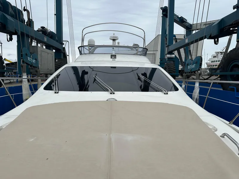 Slide: The Image of 2008 Azimut 62 Evolution yacht on a lift, showcasing sleek design and modern features. - 7