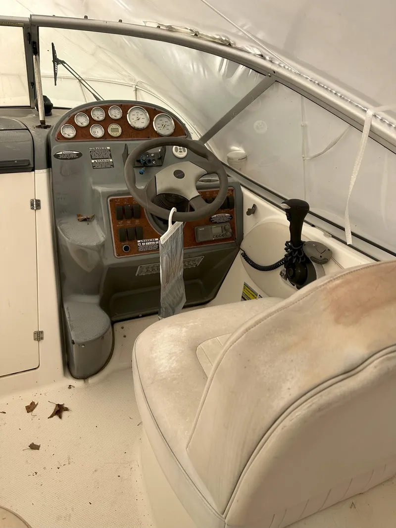 Slide: The Image of 2005 Bayliner 245 CIERA boat interior with steering wheel and control panel. - 6