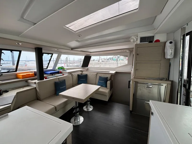 Slide: The Image of Luxurious interior of 2022 Fountaine Pajot Astrea 42 catamaran with modern seating and dining area. - 24