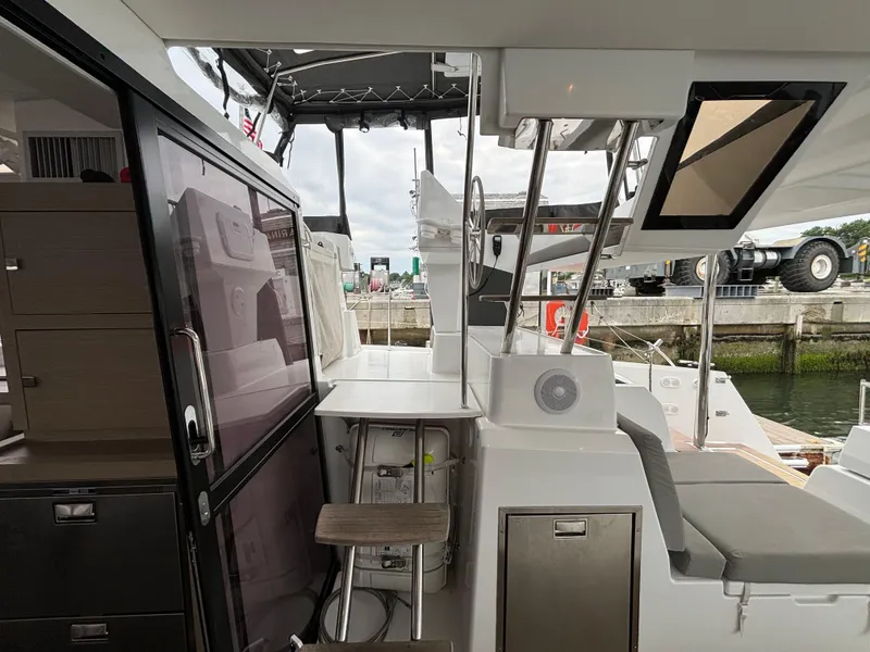 Slide: The Image of 2022 Fountaine Pajot Astrea 42 yacht interior with modern design and marina view. - 47