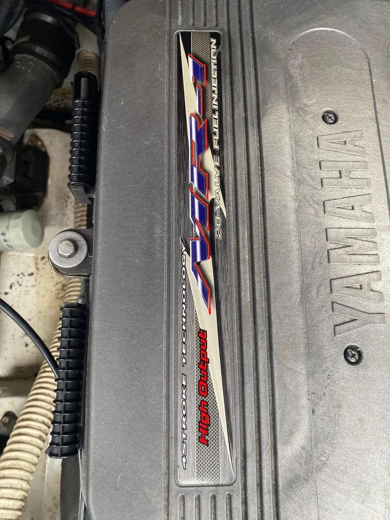 Slide: The Image of 2006 Yamaha Boats SX230 HO engine detail with high output label. - 13