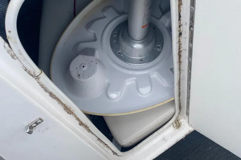 Slide: The Image of 2006 Yamaha Boats SX230 HO storage compartment with visible interior components. - 17