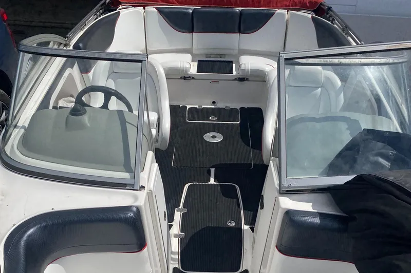 Slide: The Image of 2006 Yamaha Boats SX230 HO interior with seating and steering wheel. - 18