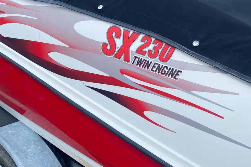 Slide: The Image of 2006 Yamaha Boats SX230 HO with red and white graphics, twin engine design. - 6