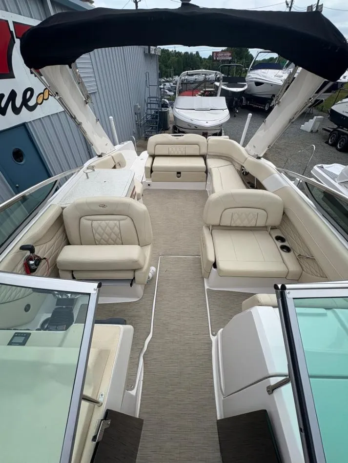 Slide: The Image of 2018 Regal 26 FasDeck boat with spacious seating and elegant interior design. - 13