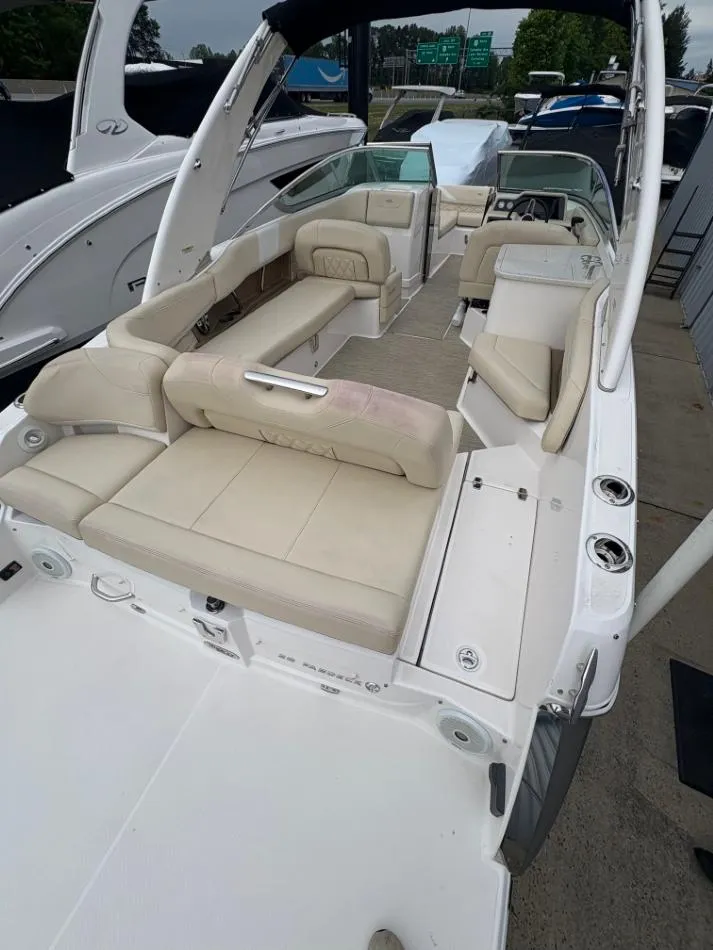 Slide: The Image of 2018 Regal 26 FasDeck boat with spacious seating and modern design. - 14