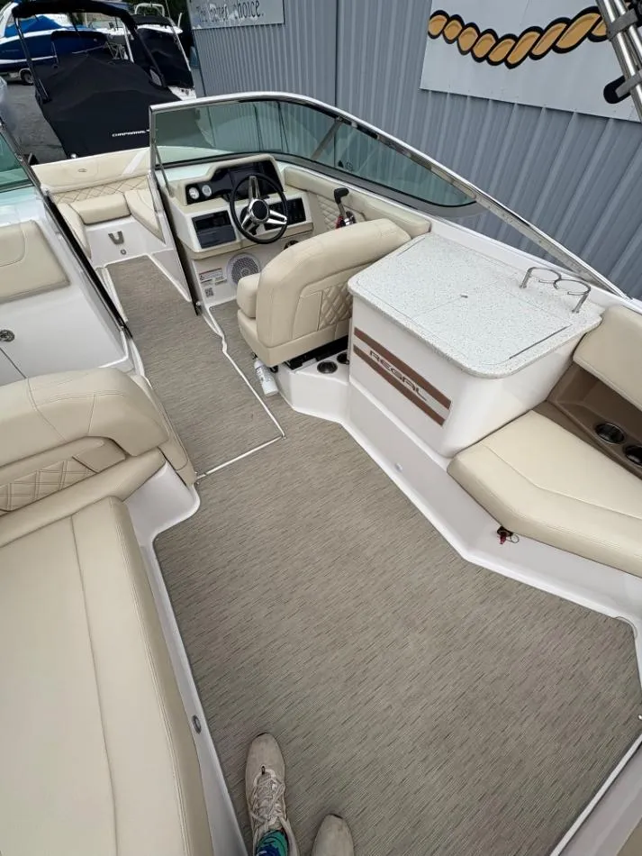 Slide: The Image of 2018 Regal 26 FasDeck boat interior with beige seating and modern dashboard. - 17