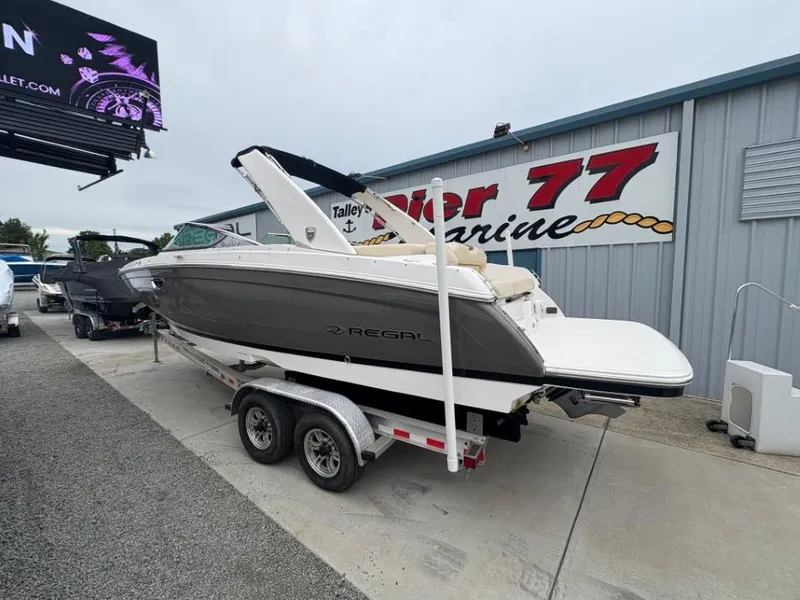 Slide: The Image of 2018 Regal 26 FasDeck boat on trailer at Pier 77 Marine dealership. - 3