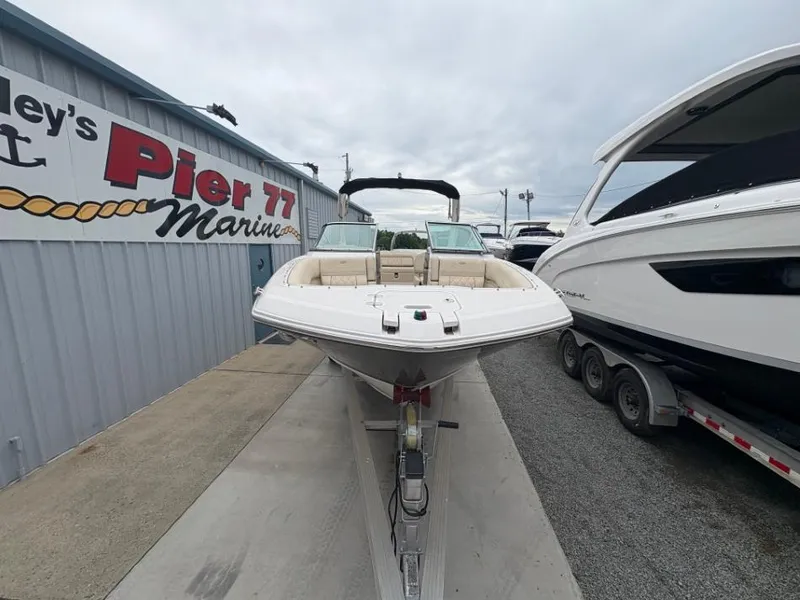 Slide: The Image of 2018 Regal 26 FasDeck boat displayed at Pier 77 Marine dealership. - 6