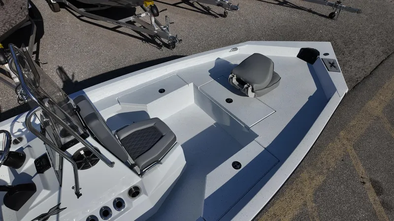 Slide: The Image of 2025 Xpress H20B boat interior with seating and storage compartments. - 25