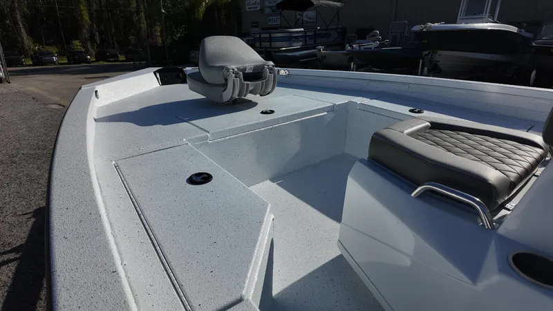 Slide: The Image of 2025 Xpress H20B boat interior with seating and storage compartments. - 33