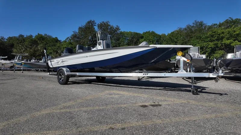 Slide: The Image of 2025 Xpress H20B boat on trailer in outdoor setting. - 4