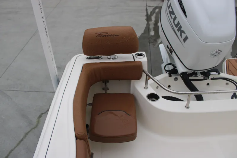 Slide: The Image of 2025 Pioneer 222 Sportfish boat with Suzuki engine and brown seating. - 16
