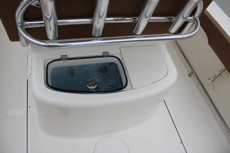 Slide: The Image of 2025 Pioneer 222 Sportfish boat with livewell and rod holders. - 18