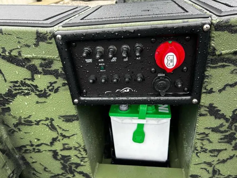 Slide: The Image of Control panel of 2025 Gator Tail 1750 MID DECK SAVAGE boat with battery compartment. - 10