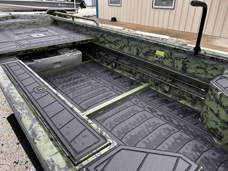 Slide: The Image of 2025 Gator Tail 1750 MID DECK SAVAGE boat interior with camouflage design and storage compartments. - 12