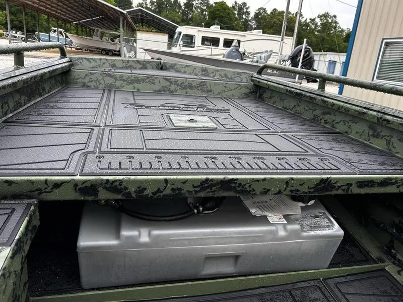 Slide: The Image of 2025 Gator Tail 1750 MID DECK SAVAGE boat with textured deck and storage compartment. - 14