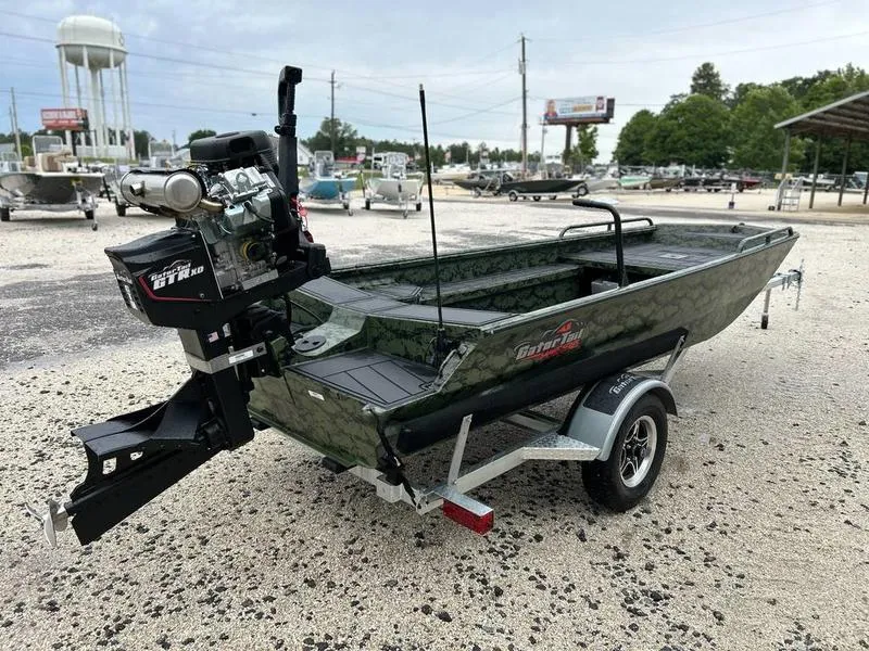 Slide: The Image of 2025 Gator Tail 1750 MID DECK SAVAGE boat on trailer in outdoor setting. - 5