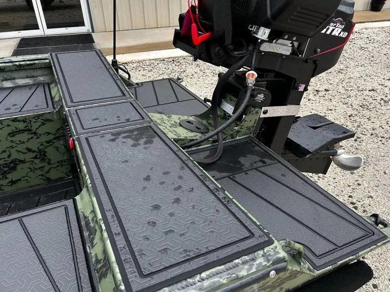 Slide: The Image of 2025 Gator Tail 1750 MID DECK SAVAGE boat with textured deck and motor detail. - 9