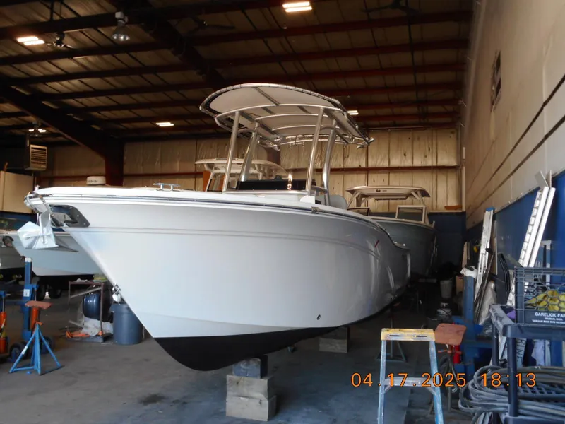 Slide: The Image of 2020 Sea Fox 228 Commander boat in a warehouse setting. - 1