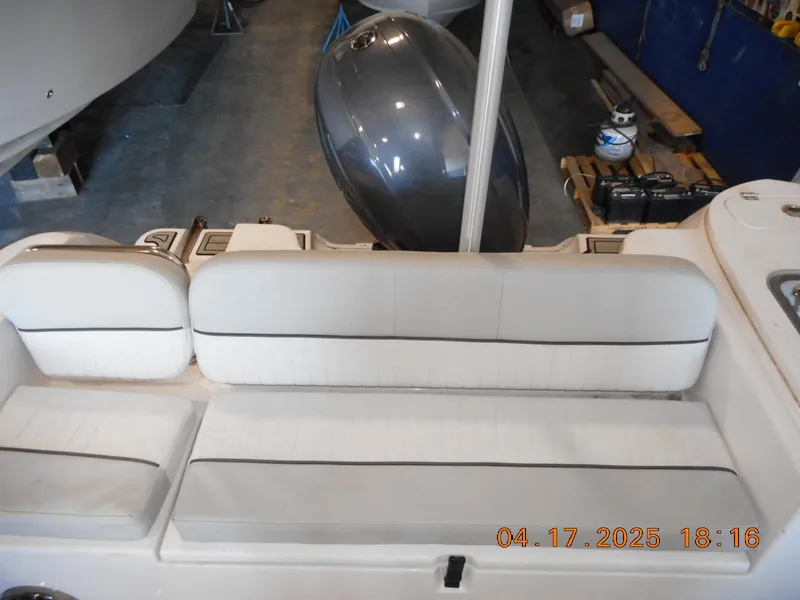 Slide: The Image of 2020 Sea Fox 228 Commander boat interior with white seating, viewed from above. - 10