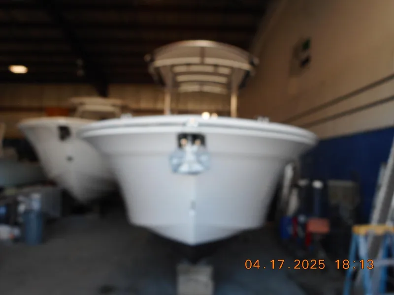 Slide: The Image of Blurry image of a 2020 Sea Fox 228 Commander boat in a storage facility. - 2