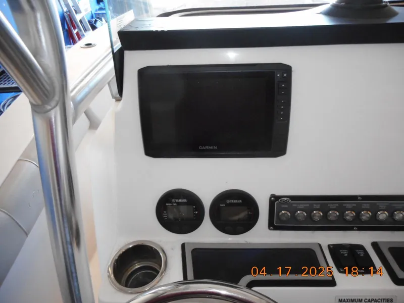 Slide: The Image of Control panel of a 2020 Sea Fox 228 Commander boat with Garmin display and gauges. - 6