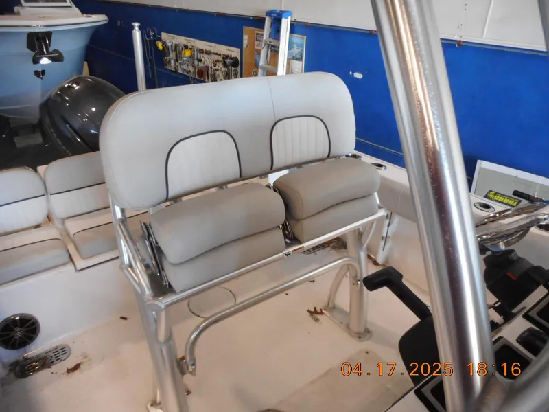 Slide: The Image of 2020 Sea Fox 228 Commander boat interior with cushioned seating and steering console. - 9