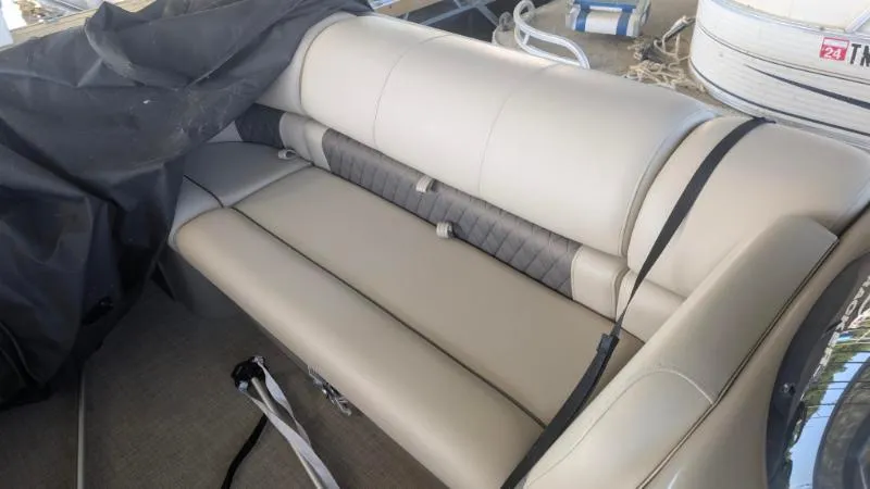 Slide: The Image of 2023 Sun Tracker Party Barge 20 DLX interior seating with beige upholstery. - 21
