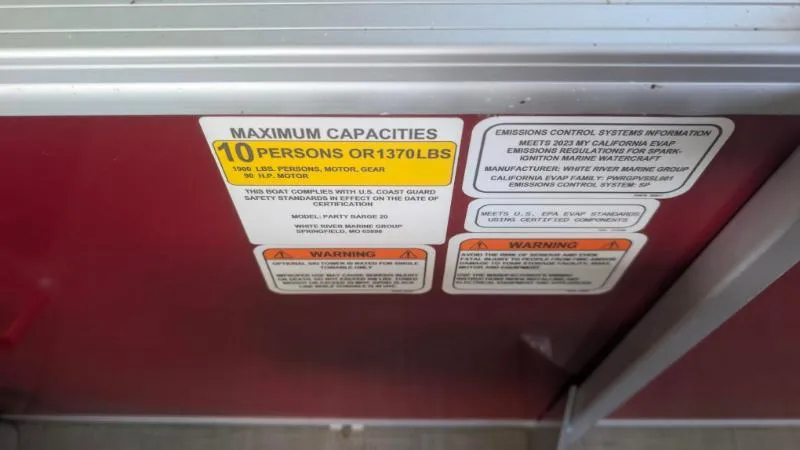 Slide: The Image of 2023 Sun Tracker Party Barge 20 DLX capacity label, maximum 10 persons or 1370 lbs. - 24