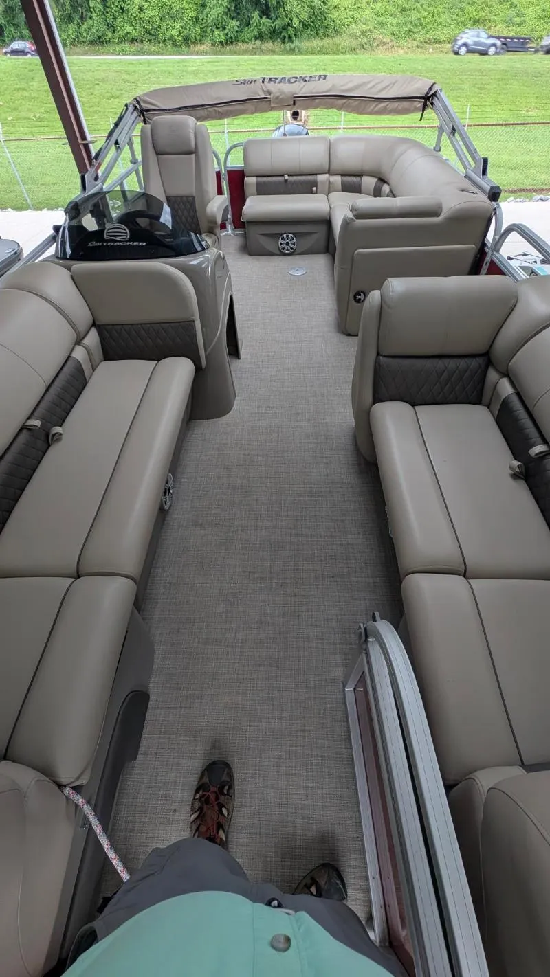 Slide: The Image of 2023 Sun Tracker Party Barge 20 DLX interior with spacious seating and modern design. - 3