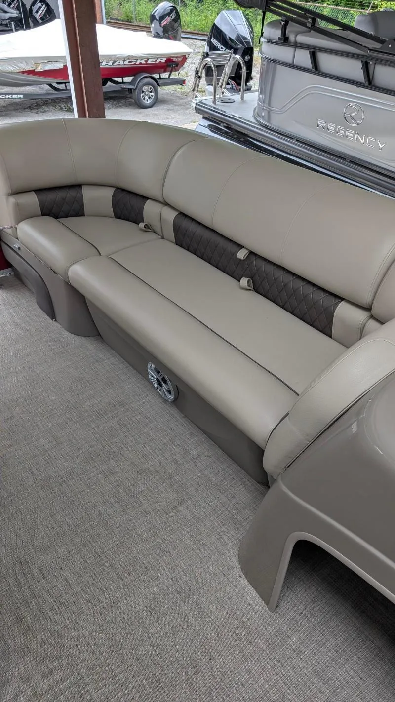 Slide: The Image of 2023 Sun Tracker Party Barge 20 DLX interior seating with beige upholstery. - 5