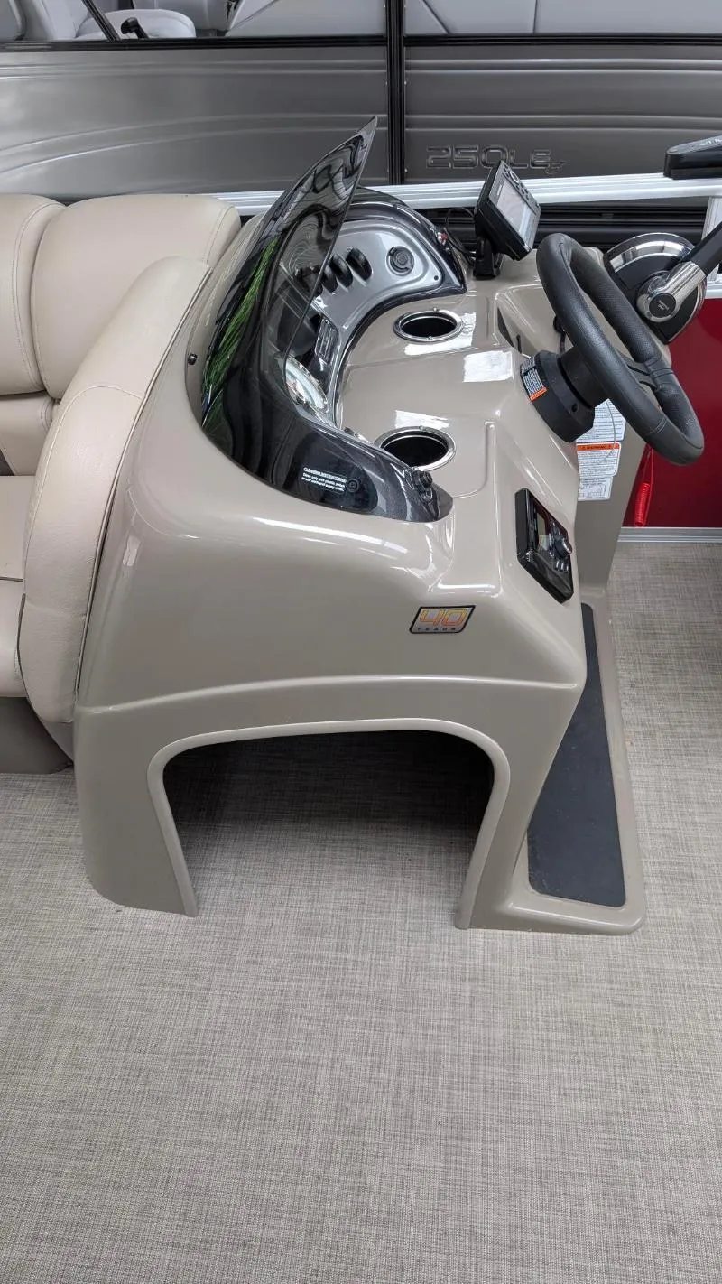 Slide: The Image of 2023 Sun Tracker Party Barge 20 DLX helm with steering wheel and controls. - 7