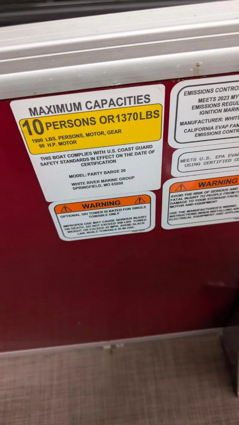 Slide: The Image of 2023 Sun Tracker Party Barge 20 DLX capacity label, 10 persons or 1370 lbs limit. - 9