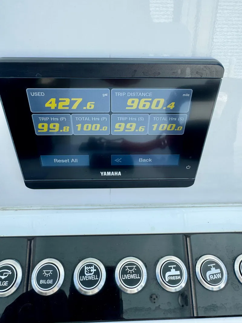 Slide: The Image of Yamaha display on 2023 Contender 24S showing fuel usage and trip distance. - 12