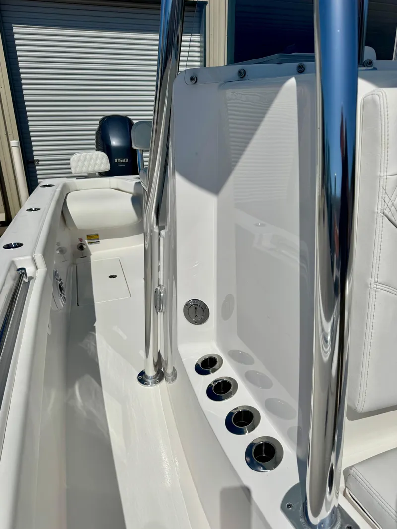 Slide: The Image of 2023 Contender 24S boat interior with sleek design and chrome accents. - 18