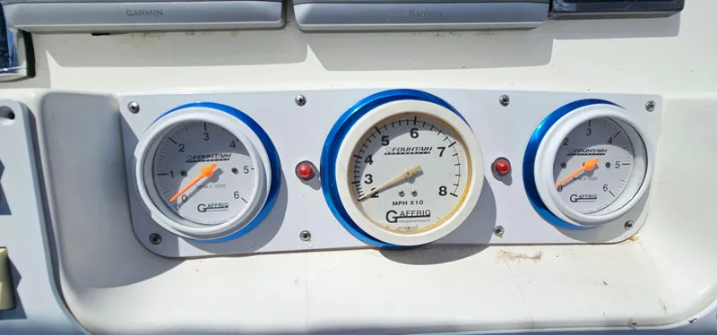 Slide: The Image of Gauge panel on a 2002 Fountain 38 Express Cruiser boat dashboard. - 21
