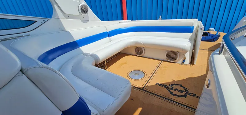 Slide: The Image of 2002 Fountain 38 Express Cruiser interior with white and blue seating. - 23