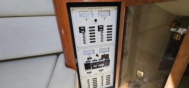 Slide: The Image of Electrical panel on a 2002 Fountain 38 Express Cruiser boat interior. - 34