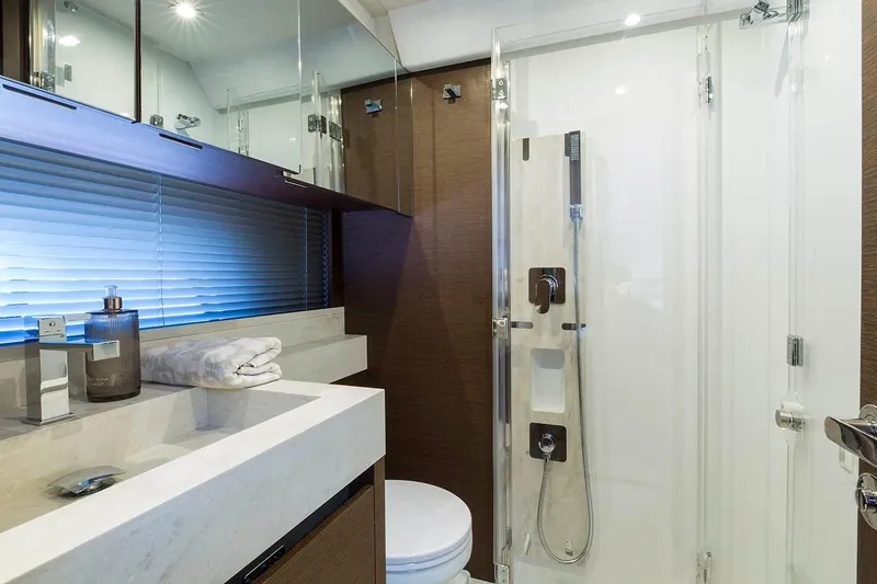 Slide: The Image of Luxurious bathroom in 2019 Prestige 520S yacht with modern fixtures and sleek design. - 16