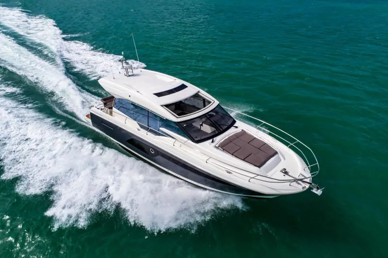 Slide: The Image of 2019 Prestige 520S yacht cruising on open water, showcasing sleek design and luxury features. - 9