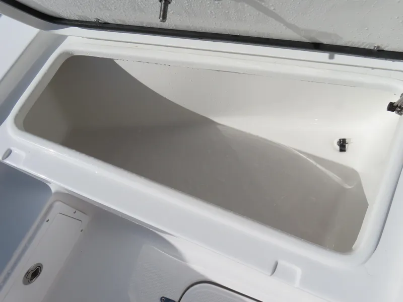 Slide: The Image of 2024 Sea Hunt Gamefish 25 storage compartment, open and empty, showcasing interior space. - 13
