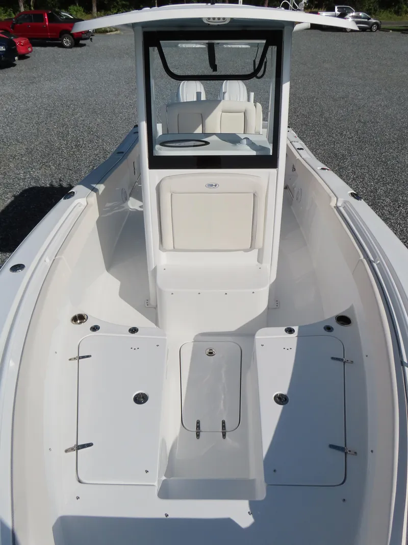 Slide: The Image of 2024 Sea Hunt Gamefish 25 boat, spacious deck, center console, white finish. - 17