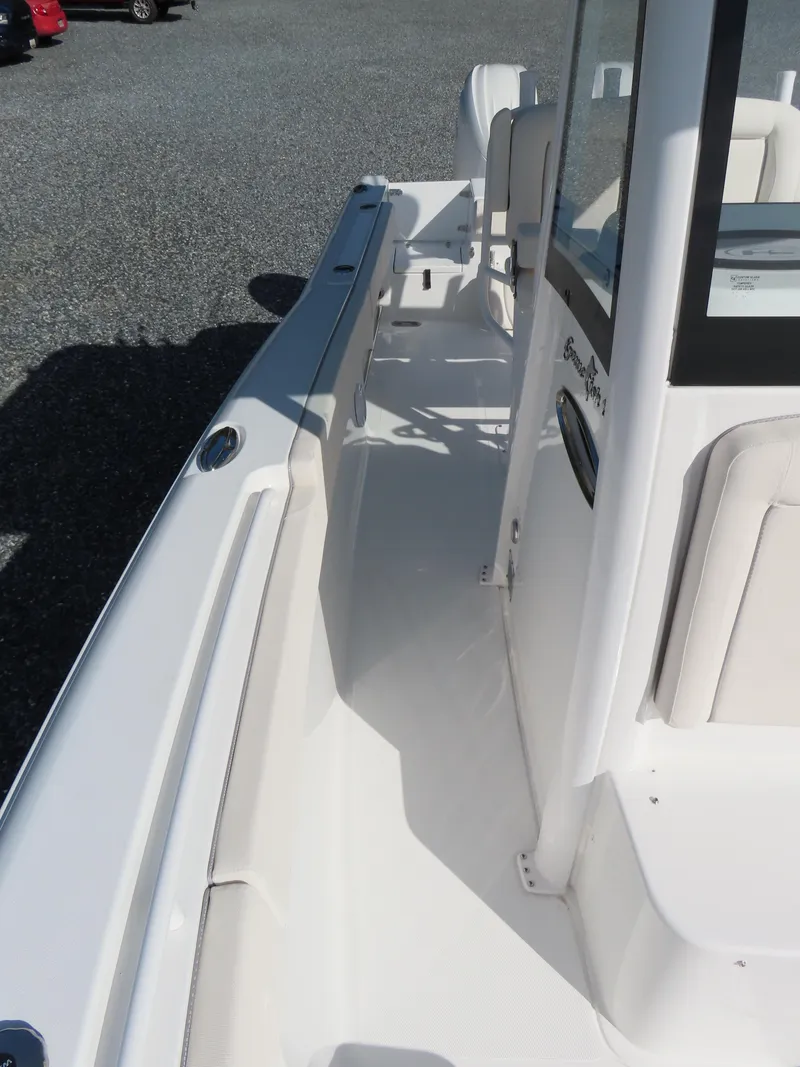 Slide: The Image of 2024 Sea Hunt Gamefish 25 boat deck, featuring sleek design and spacious layout. - 18