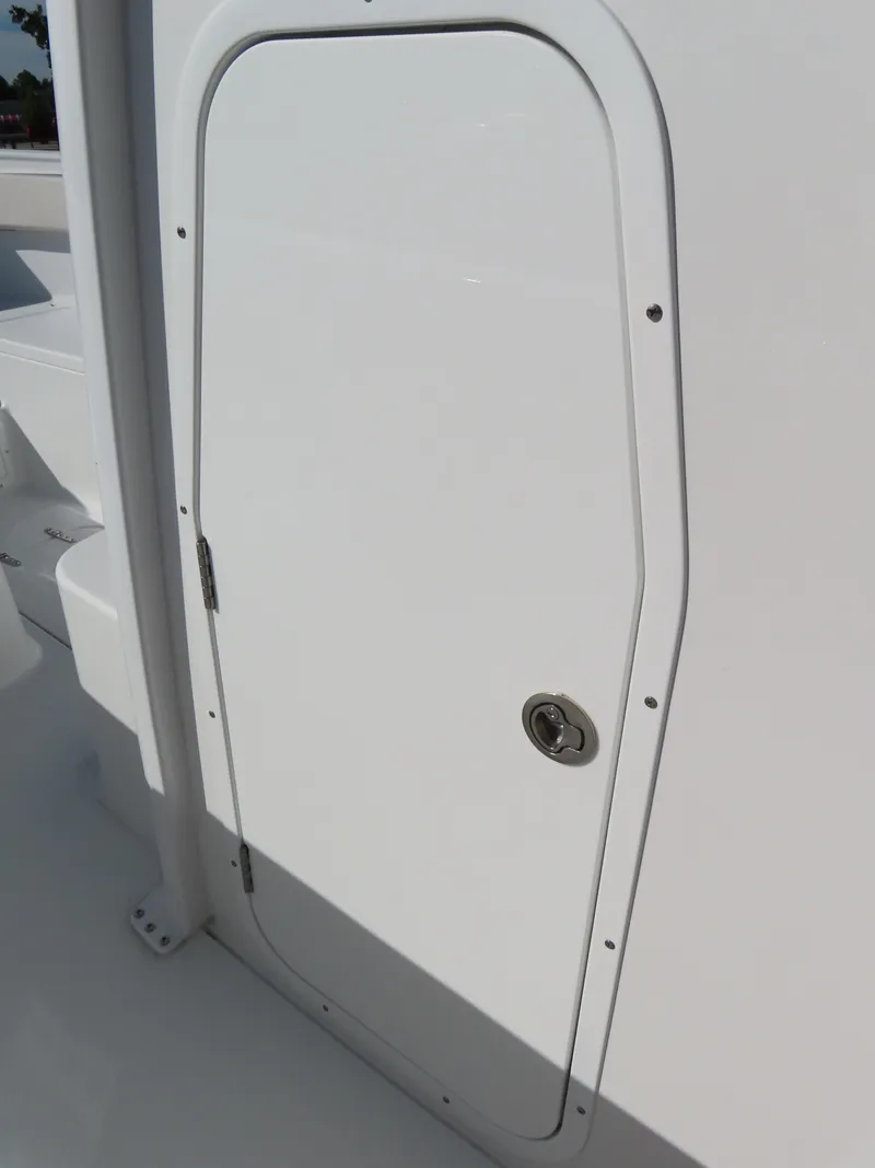 Slide: The Image of 2024 Sea Hunt Gamefish 25 boat hatch door, white with metal handle. - 20
