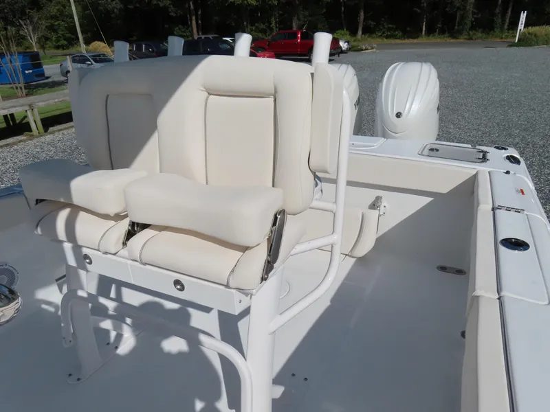 Slide: The Image of 2024 Sea Hunt Gamefish 25 boat interior with white seating and console. - 22