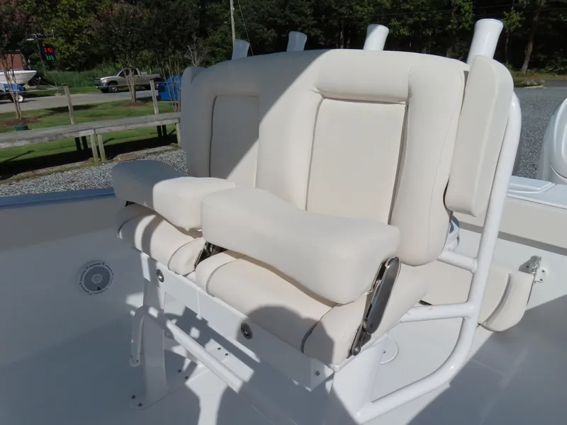 Slide: The Image of 2024 Sea Hunt Gamefish 25 boat seating with white cushioned seats and sturdy frame. - 23