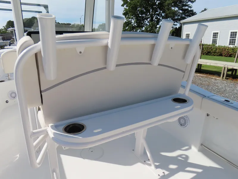 Slide: The Image of 2024 Sea Hunt Gamefish 25 boat interior with rod holders and cup holders. - 27